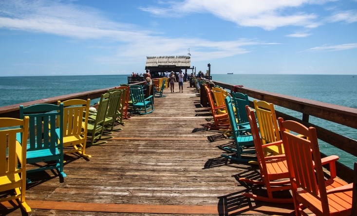 pier with chairs at cocoa beach