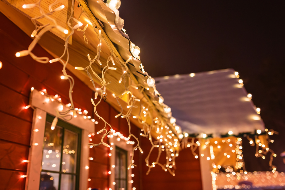 Lit up Christmas lights outside of a house